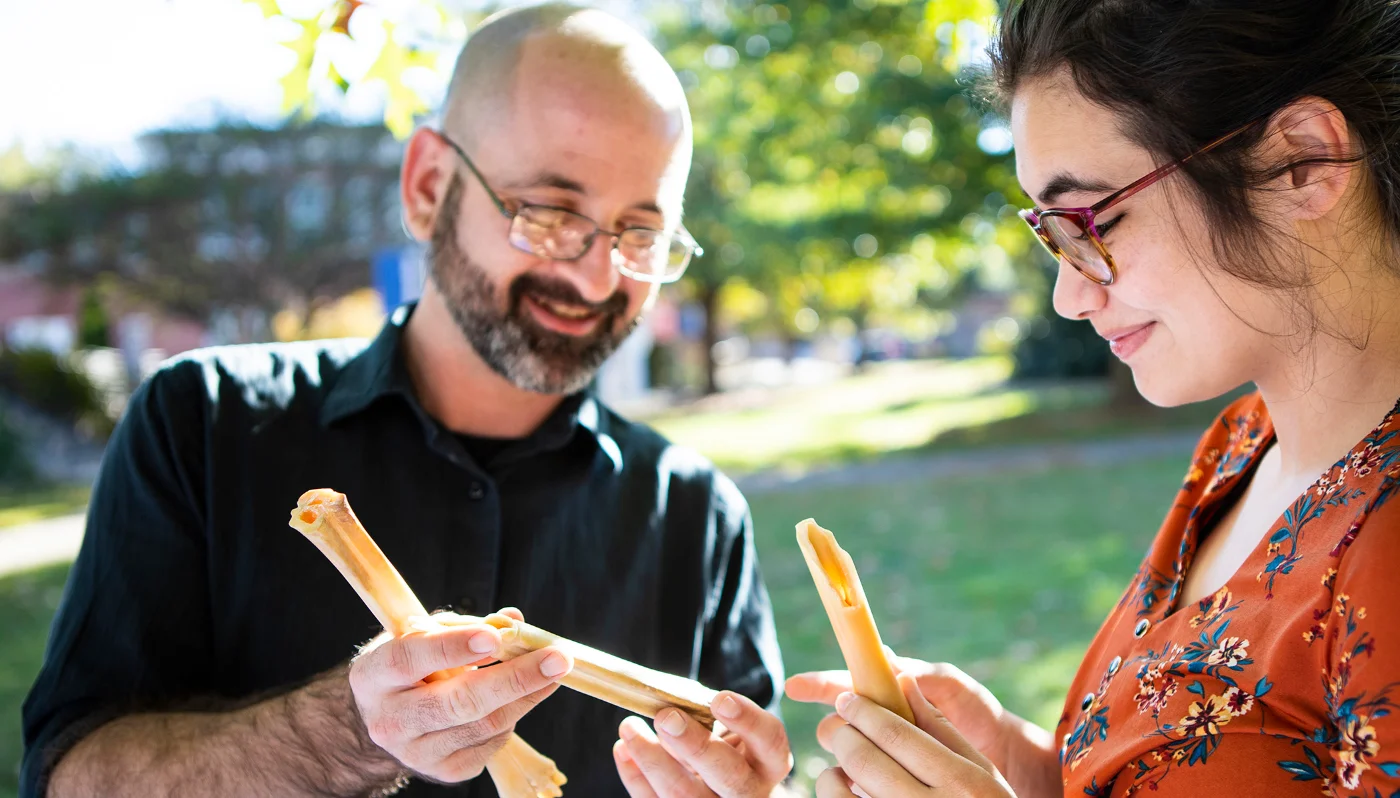 student studying bones