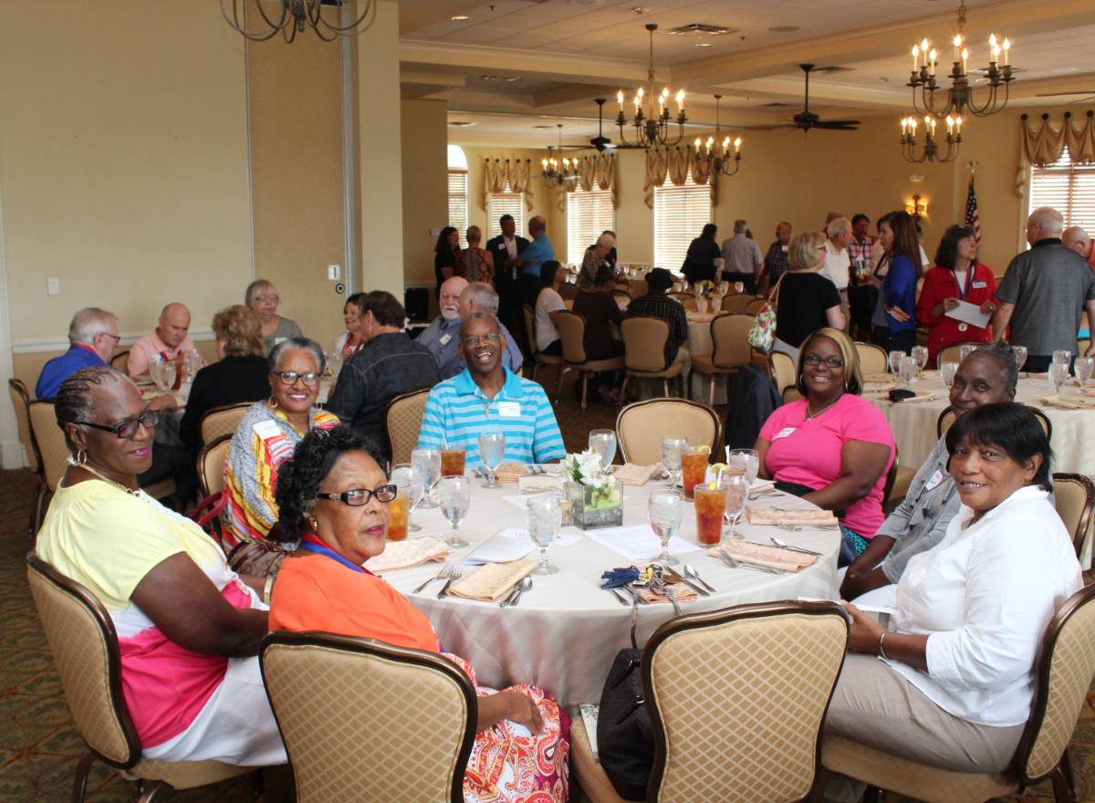 Dining hall filled with several retired people