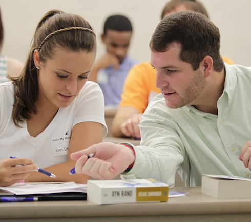boy and girl at desk writing
