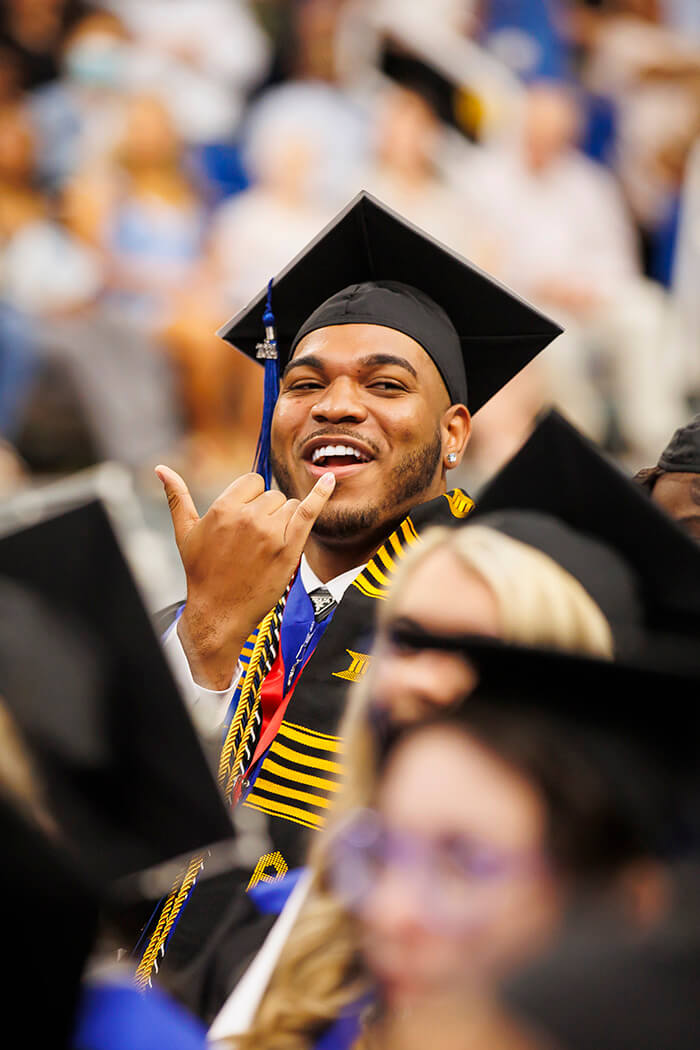 UWG graduate celebrating at commencement