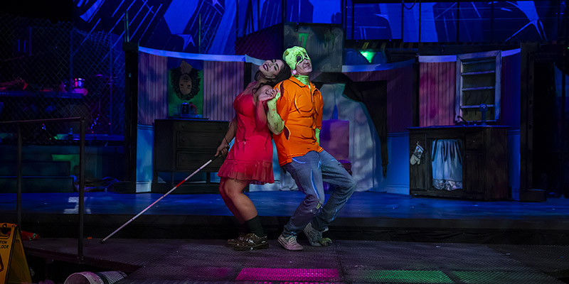 Toxic Avenger on stage back to back with female lead