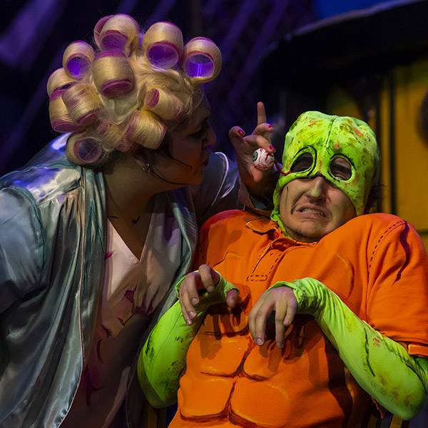 The Toxic Avenger with female character in curlers holding his eye