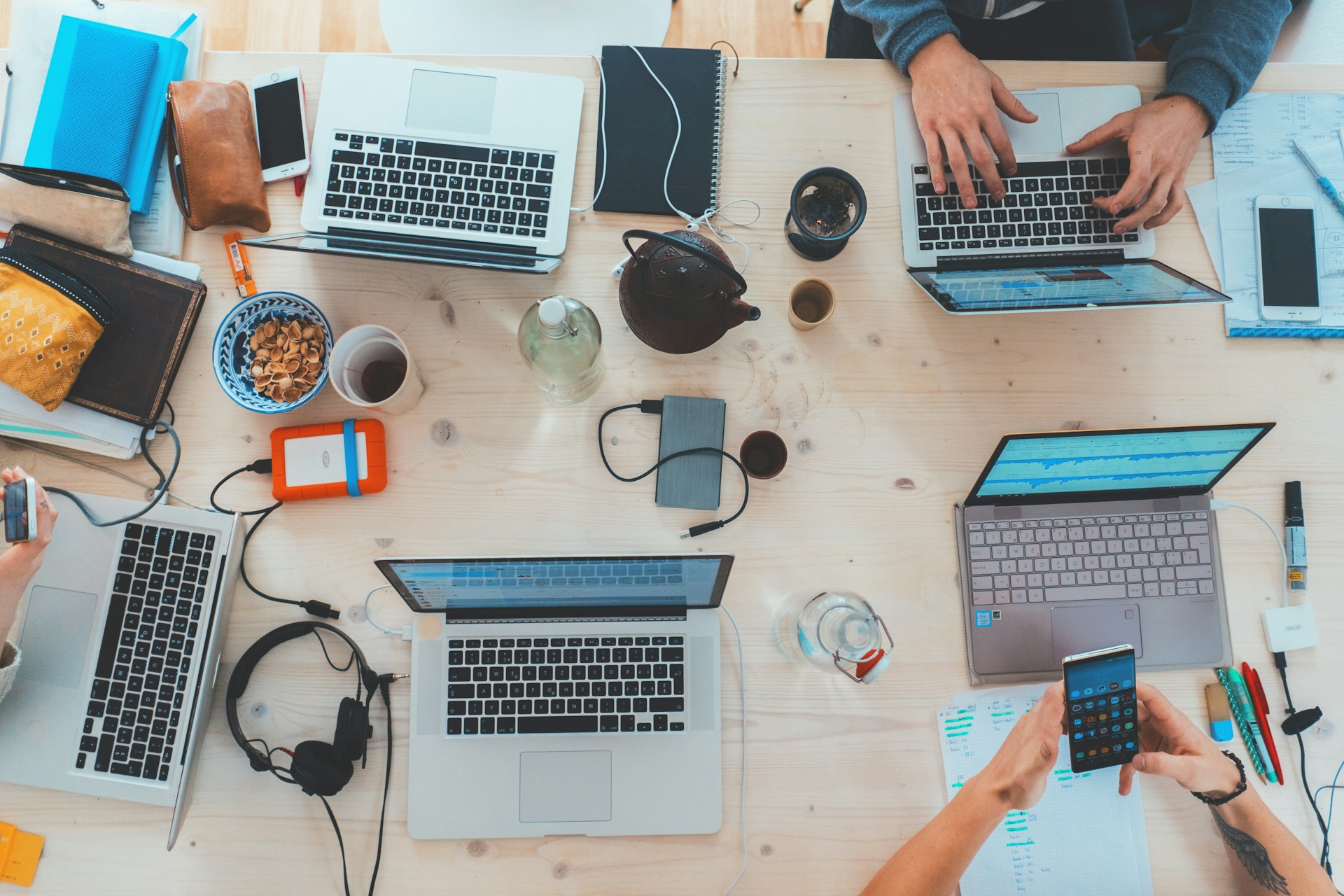 People sitting at a table on laptops